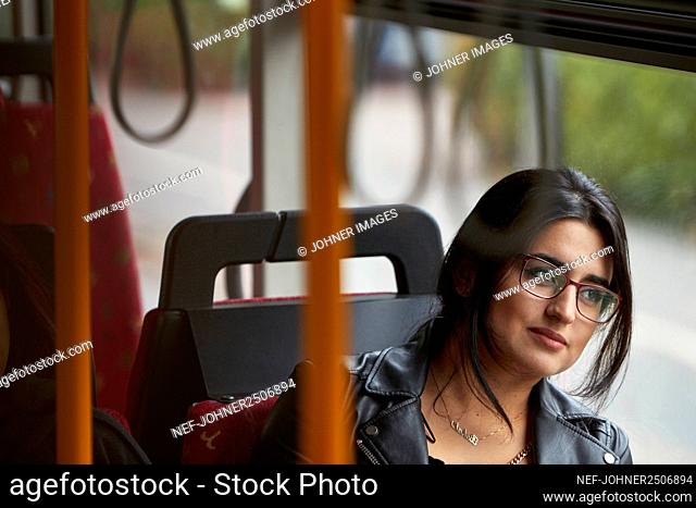 Smiling woman in bus