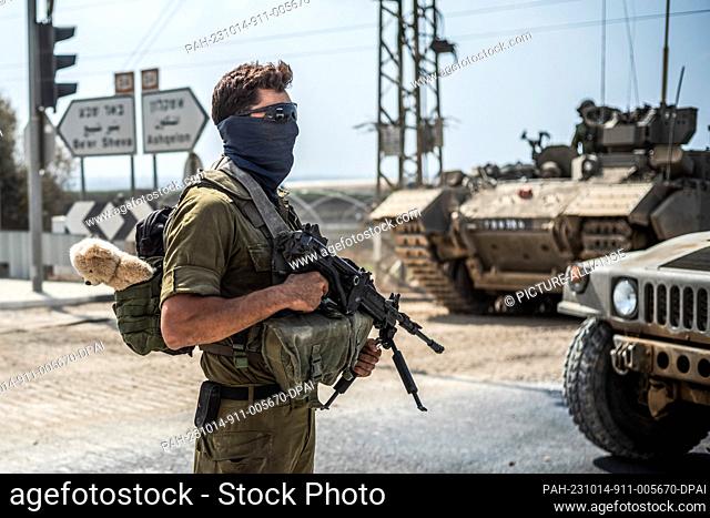14 October 2023, Israel, Sderot: An Israeli soldier stands guard near the Israeli-Gaza border as fighting between Israeli troops and the militants of the...