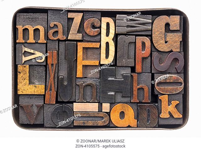 vintage letterpress wood type blocks with ink patina - all 26 letters of alphabet in an old metal box
