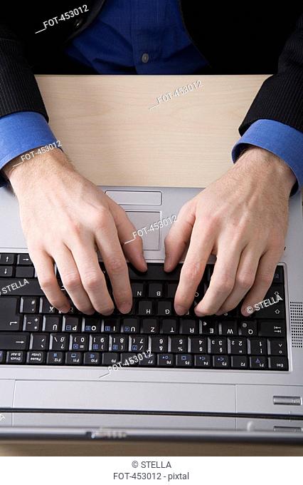 Businessman typing on a laptop