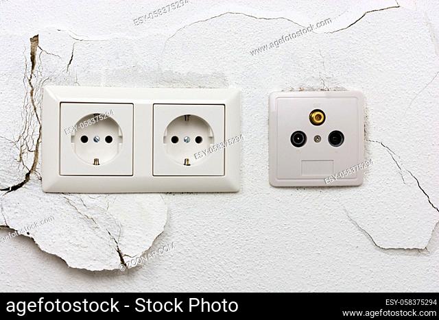 Wall plaster loosens around sockets