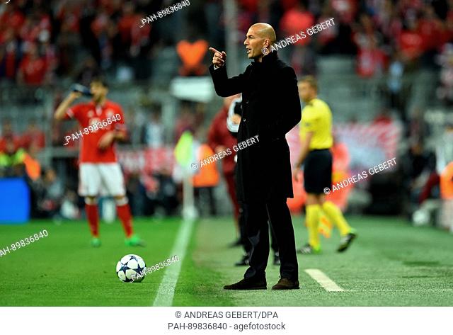 Madrid's coach Zinedine Zidane reacts during the first leg of the Champions League quarter final match between Bayern Munich and Real Madrid in the Allianz...
