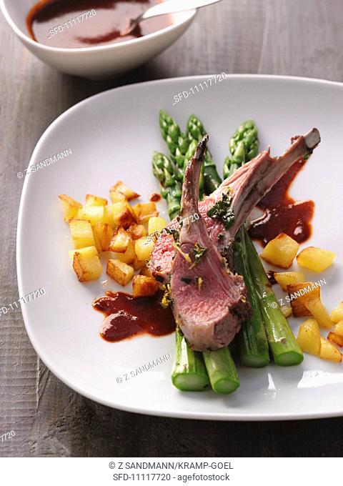 Saddle of lamb with roast potatoes and asparagus