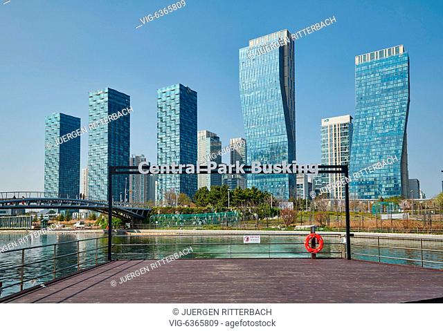 Central Park in Songdo International Business District with skyscraper in the back, Incheon City, South Korea - Incheon City, , South Korea, 19/04/2019