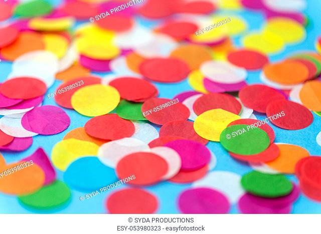 colorful confetti decoration on blue background