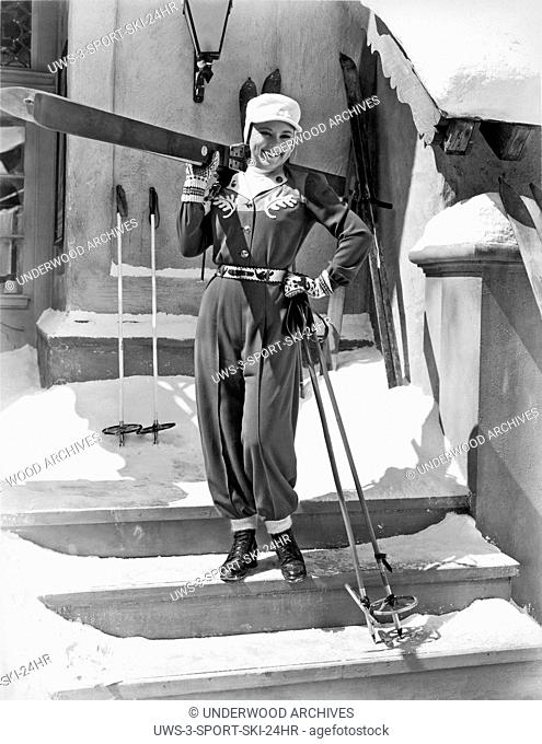 California: c. 1936.World champion ice skater Sonja Henie poses with her ski gear
