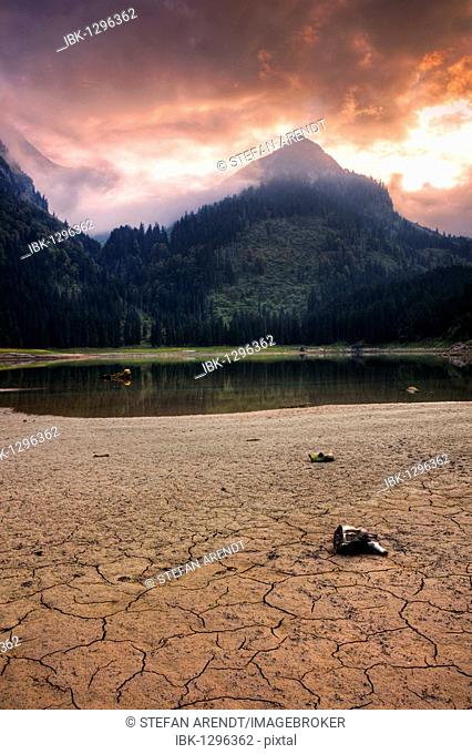 Almost dried out Voralpsee lake in the Swiss Alps above the Rhine Valley at Buchs, Switzerland, Europe