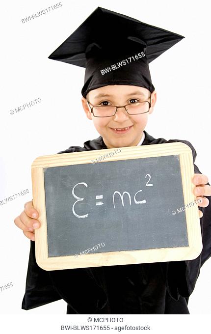 small boy as diploma holder with the theory of relativity on a blackboard