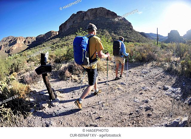 Backpacking couple hiking in Superstition mountains, Arizona, USA