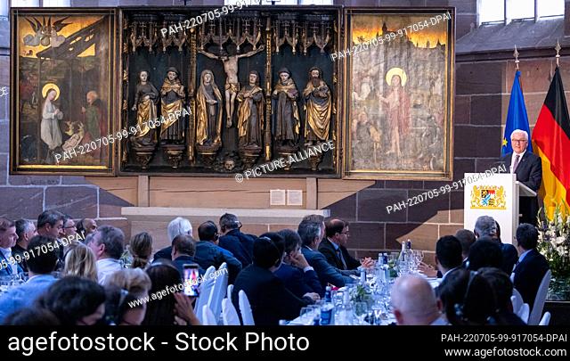 05 July 2022, Bavaria, Nuremberg: Federal President Frank-Walter Steinmeier (r) speaks at the Carthusian Church during a visit to the Germanic National Museum...