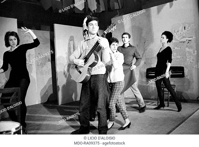 Italian actor Gigi Proietti, playing a guitar, and Italian actor and director Giancarlo Cobelli in the theater play Can Can degli italiani in Arlecchino theater