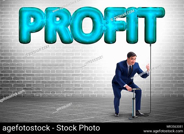 Businessman pumping profit in business concept