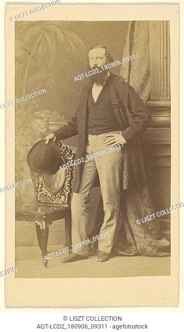 bearded man standing with one hand on hip, the other with hat in hand on chair back; F. Schwarzschild (British, active Calcutta
