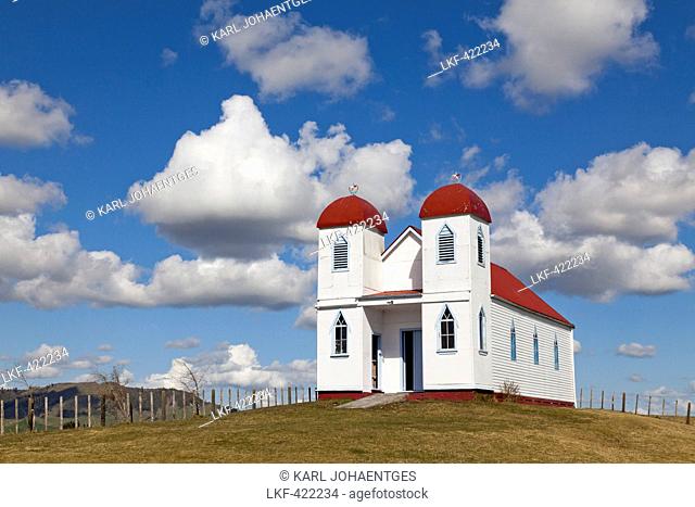 blocked for illustrated books in Germany, Austria, Switzerland: Ratana church on a hill near Raetihi, White church with red roof and twin towers representing...
