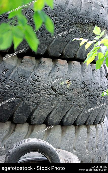 dumping of tires on the wheels in the open air. environmental problem