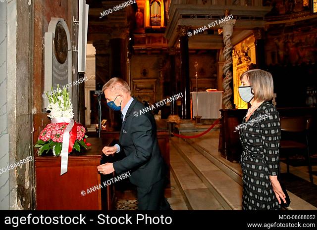 The Polish Ambassador to the Holy See Janusz Kota?ski and his wife Anna pray and offer a bouquet of flowers in front of the commemorative plaque of Cardinal...