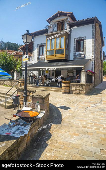 Paella and restaurant at La Plazuela Square. Riocorvo, Cantabria, Spain