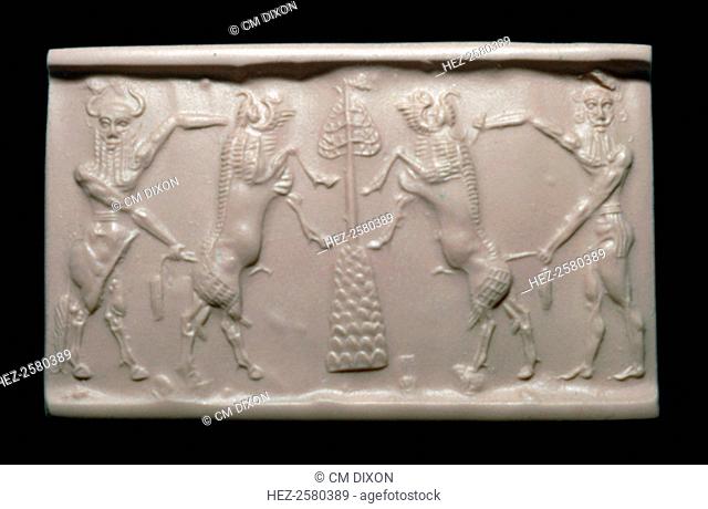 Akkadian cylinder-seal impression of a bull-man and hero. Each is holding a bull by the horns, and in the centre is a stylised mountain with a sacred tree on...