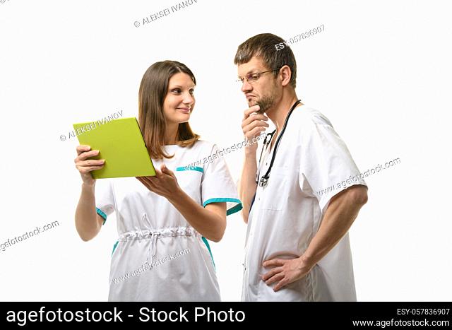 Doctor grimaces at patient test results