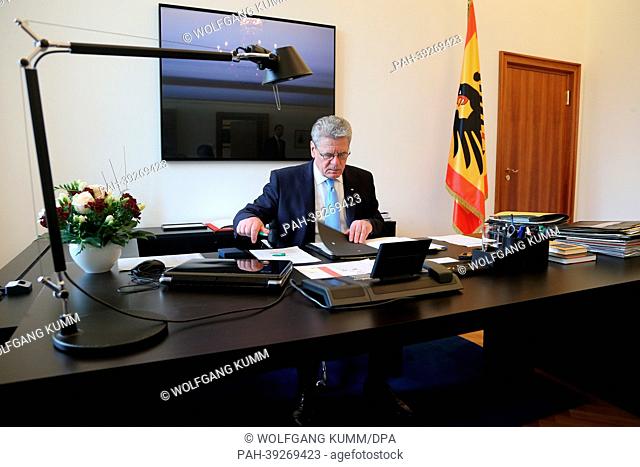 German President Joachim Gauck sits in his office at Bellevue Palace in Berlin, Germany, 06 May 2013. Behind him hangs the painting 'A.D