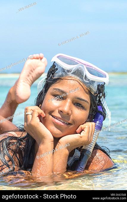 Portrait African American young woman snorkeling with mask and Bikini. Relaxing on summer tropical getaway. Caribbean destination