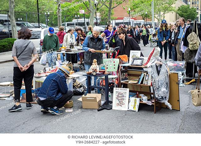 Shoppers search for bargains at the humongous Penn South Flea Market in the New York neighborhood of Chelsea. The flea market appears like Brigadoon