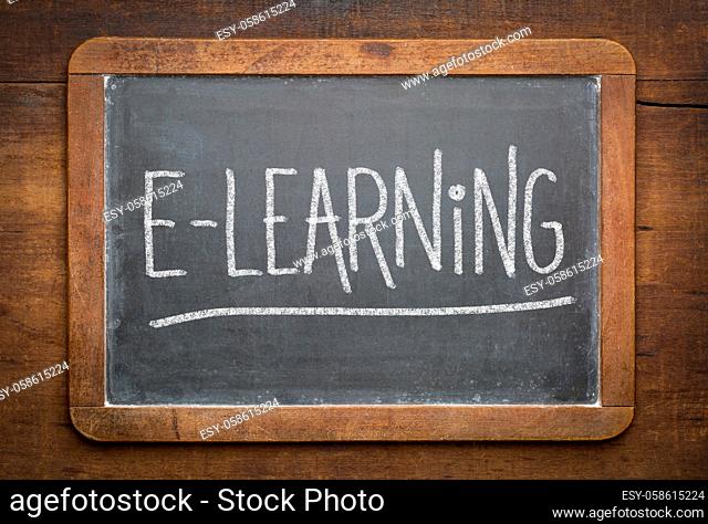 online education concept - e-learning word white chalk writing on a vintage slate blackboard