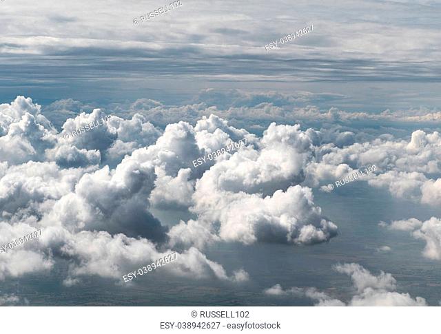 Clouds viewed from above. Taken through an aircraft window