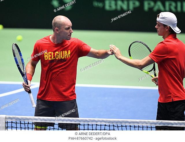 Belgium's Steve Darcis (L) and Arthur De Greef during a training session in the Fraport Arena in Frankfurt am Main, Germany, 31 January 2017