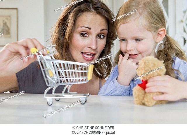 Mother and daughter playing with toys