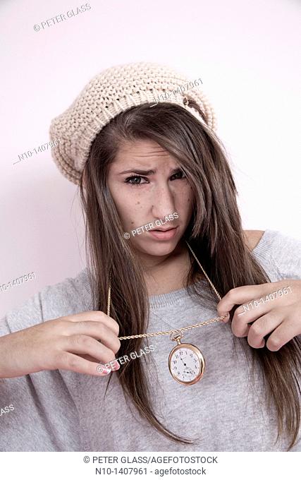 Teen girl with a pocket watch around her neck