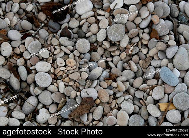 Large, small, light, dark stones on the stone beach of Albir, Alicante Province, Costa Blanca, Spain