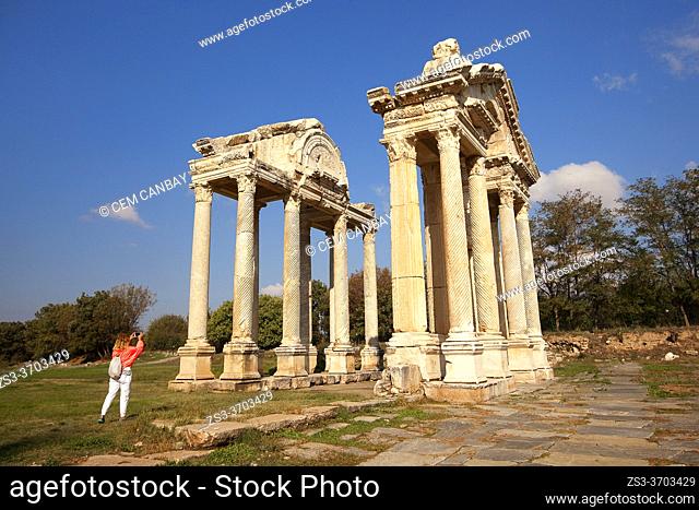 Visitor in front of the Tetrapylon, Aphrodisias, Geyre, Aydin Province, Asia Minor, Turkey, Europe