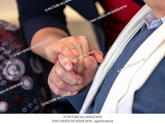 02 May 2019, Mecklenburg-Western Pomerania, Grabow: Franziska Giffey (SPD), Federal Minister for Family Affairs, holds the hand of pensioner Willi Berende when...