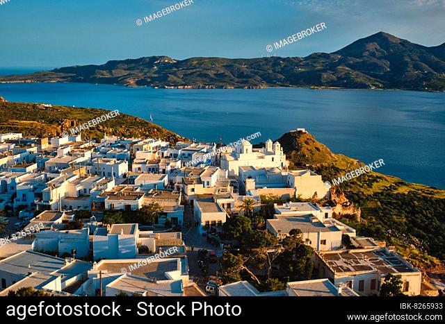 View of Plaka village on Milos island with traditional greek white houses on sunset, Plaka town, Milos island, Greece, Europe