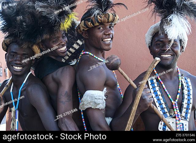 Zambian troupe dancers in traditional dress happily posing for a portrait. Troupe performed for guests at the Zambezi Sun (currently Avani Victoria Falls...