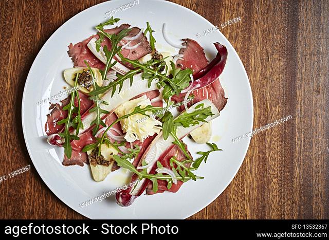Beef bresaola with chickory and rocket