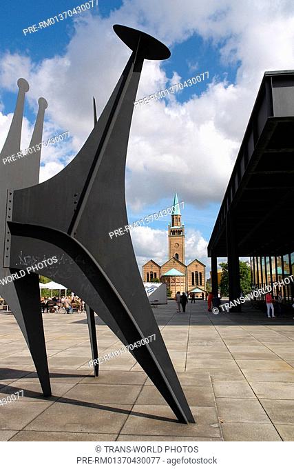 Germany, Berlin, Sculpture 'Heads and Tail' by Alexander Calder 1965 at the new National Galerie with Matthõi Church at rear