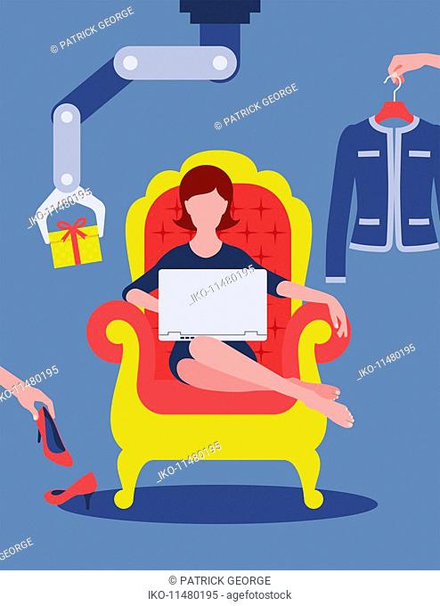 Woman online shopping for fashion from armchair