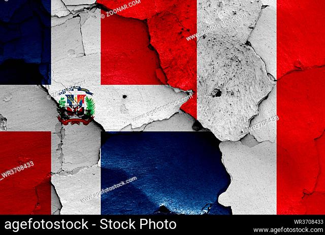 flags of Dominican Republic and Peru painted on cracked wall