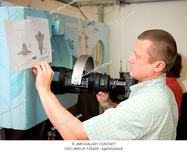 Russian cosmonaut Dmitry Kondratyev, Expedition 26 flight engineer and Expedition 27 commander, participates in a docking timeline simulation training session...