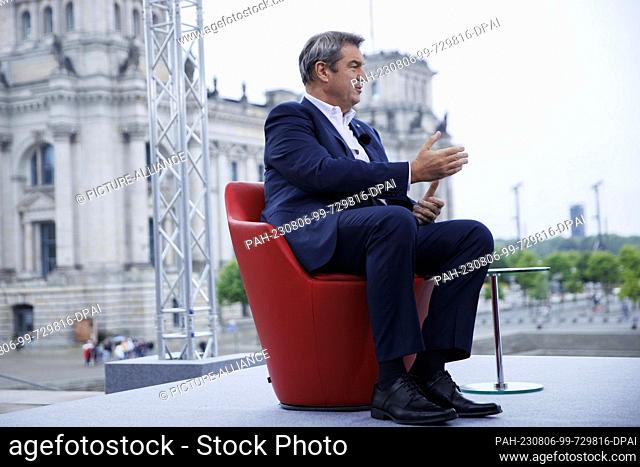 06 August 2023, Berlin: Markus Söder (CSU), federal chairman of his party, speaks shortly before recording for the ARD summer interview on the terrace of the...