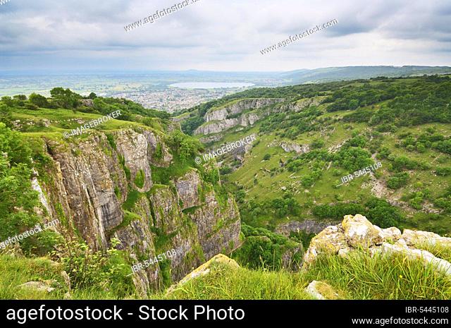View of Cheddar Gorge on the edge of the Mendip Hills in Somerset, England, Europe. The village of Cheddar and the Cheddar Reservoir lie at the end of the gorge