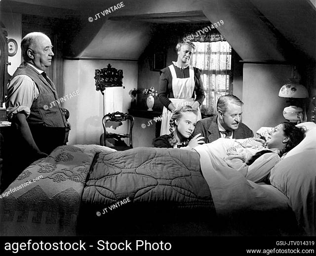 Edmund Gwenn (standing far left), Peggy Ann Garner (kneeling left), Reginald Owen (kneeling right), Jean Prescott (in bed), on-set of the Film, Bob