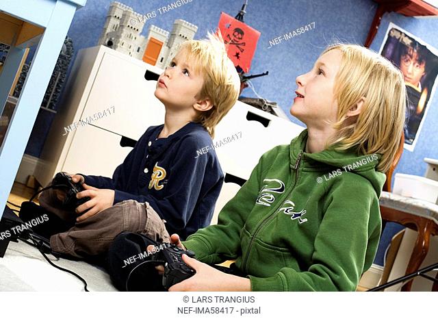 Two Scandinavian boys playing video games, Sweden