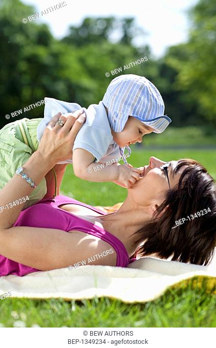 Mother spending time with her child in the garden