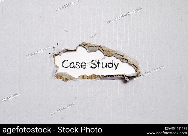 The word case study appearing behind torn paper