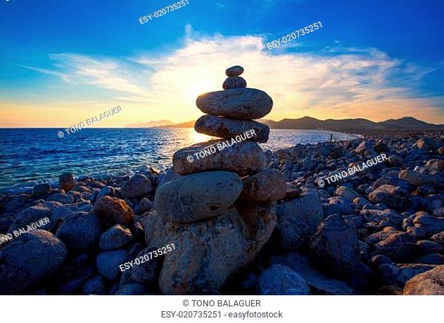 Ibiza Cap des Falco beach sunset with desire stones