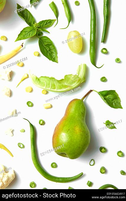 collection of green vegetables and fruits on white background