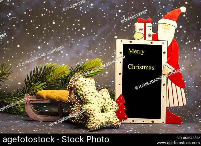 Santa Claus with Merry Christmas blackboard
